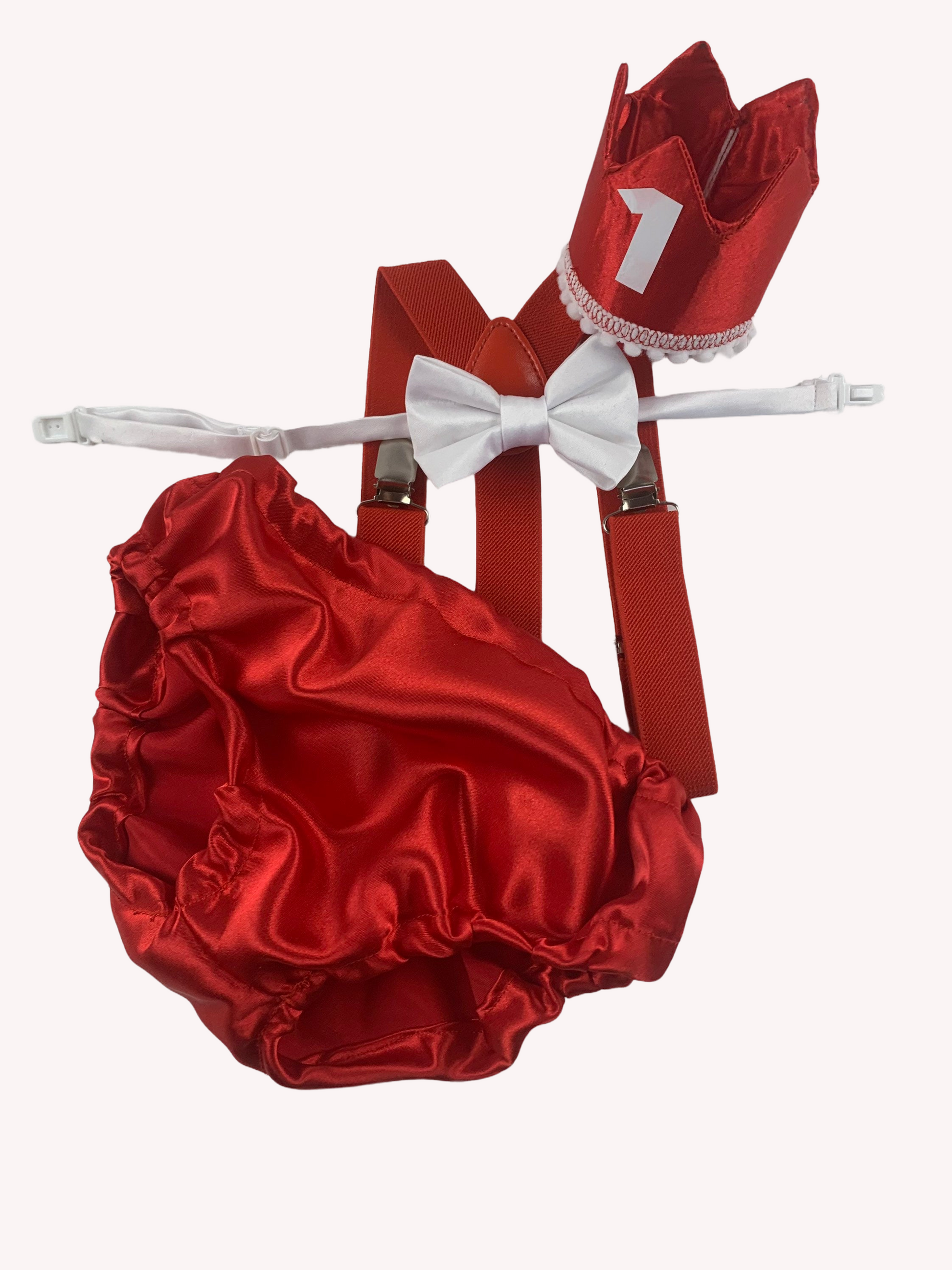 a red satin diaper with a white bow on it