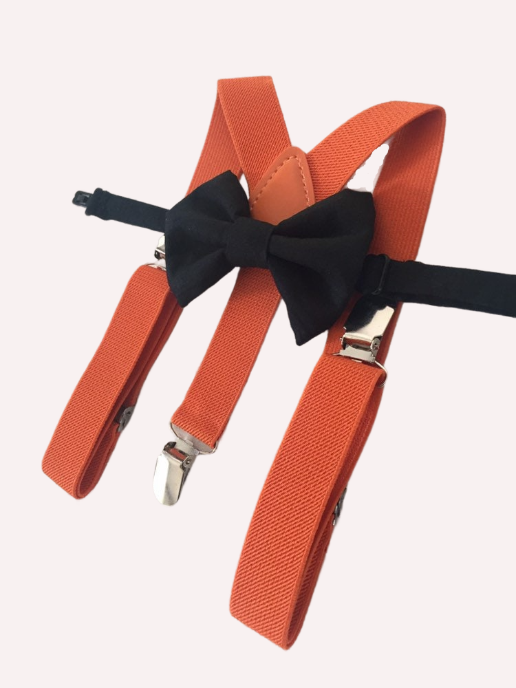 a pair of orange suspenders with a black bow tie